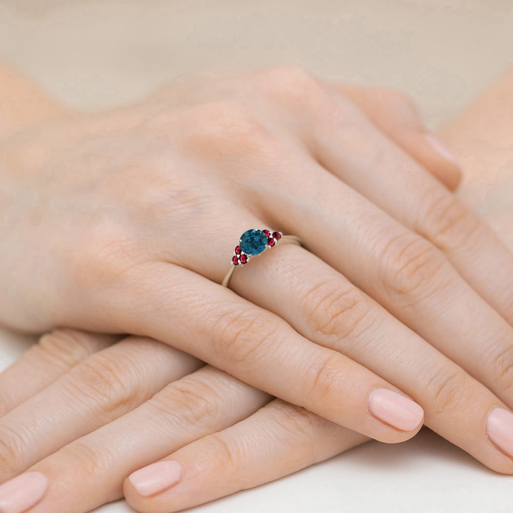 Gold Ring With London Topaz And Rubies